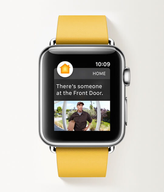 Person wearing Apple watch on wrist displaying Arlo motion alert